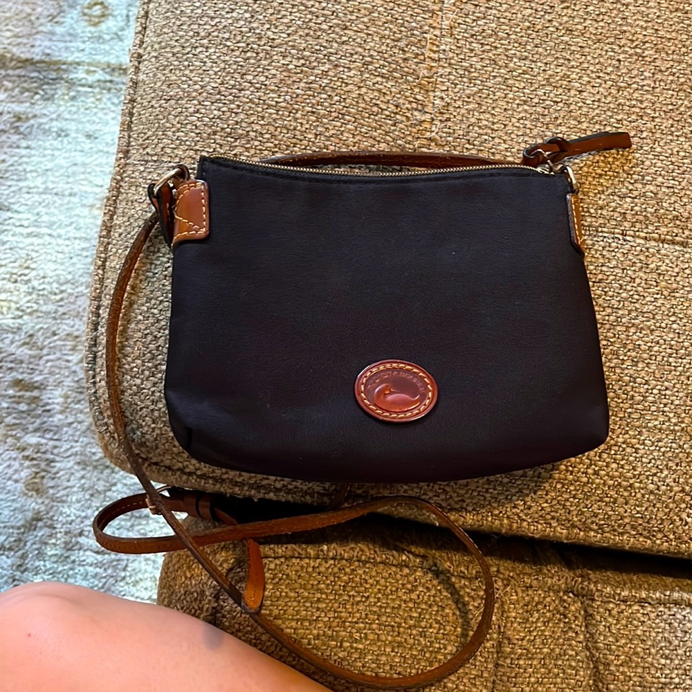 Dooney and Bourke black nylon crossbody pouchette bag with brown leather strap
